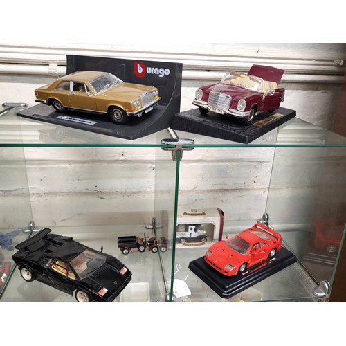 106 - Burago: 1.22 scale Rolls-Royce Camargue, black 1/18 scale Lamborghini Contach and red 1/24 scale Fer... 