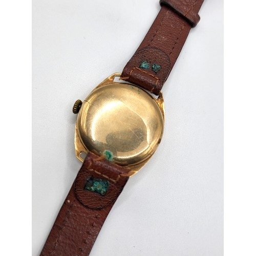 285 - A vintage Limit Sports 1940's 9ct gold wristwatch. 29.5mm case on a brown leather strap.