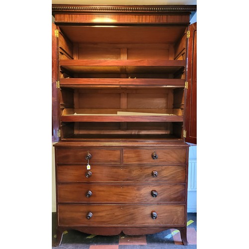 2 - A mahogany linen press by George Hepplewhite circa 1770, having two large doors enclosing three full... 