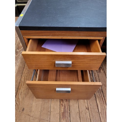 50 - A mid-century leather topped desk with drawers at the front and cupboards at the rear. 71cm x 169cm ... 