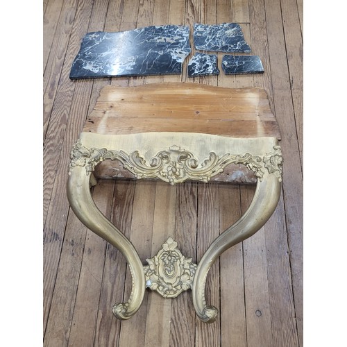 18 - Gilt wall table mahogany with marble top (broken, in four pieces). 63cm x 93cm x 34cm.