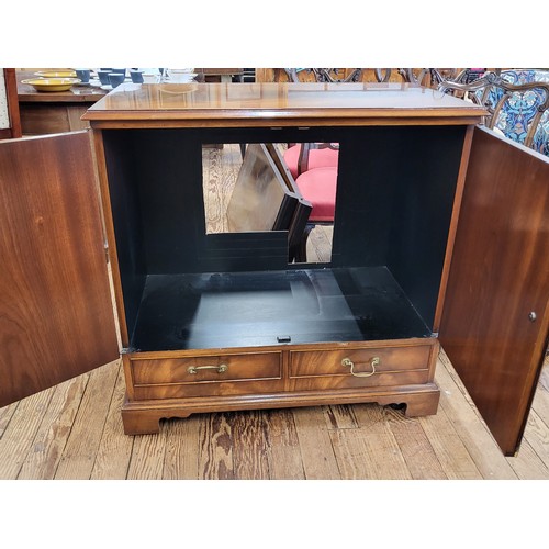 40 - A reproduction enclosed TV cabinet has two doors over a pull down flap. 87cm x 87 cm x 47cm.