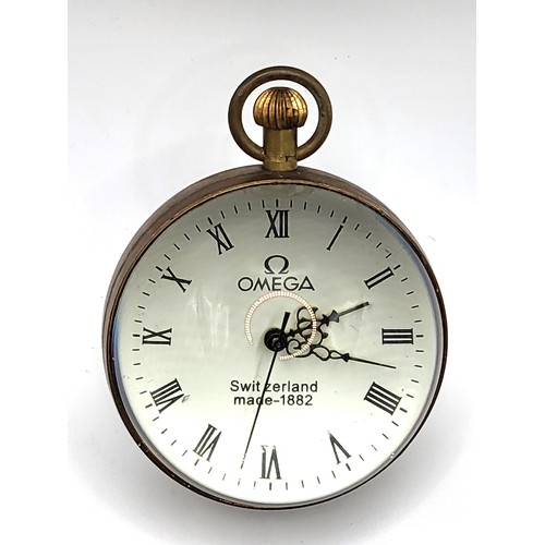 60 - A brass and glass desk ball clock. 8cm. 355gms