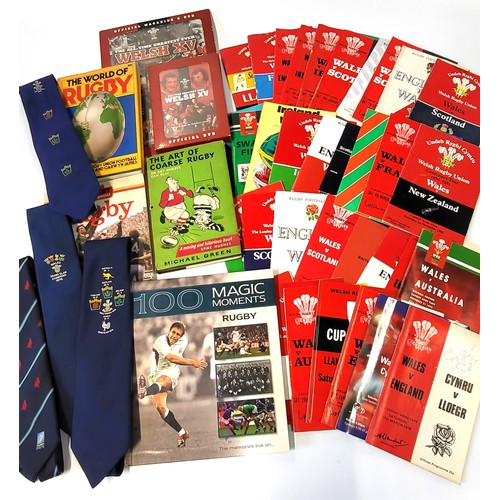 140 - A collection of rugby memorabilia, predominantly Welsh including programmes some signed, books and t... 