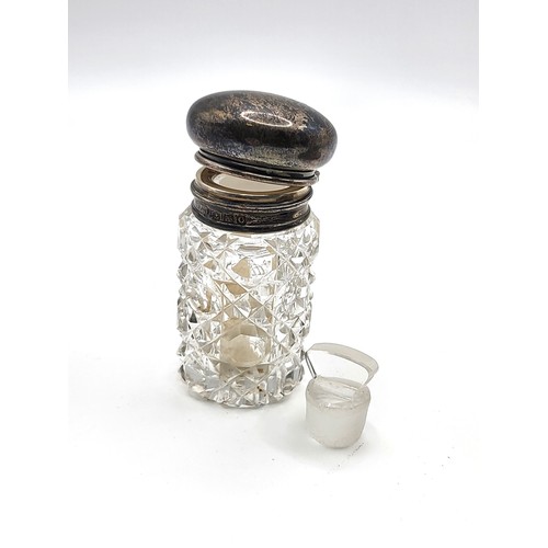 258 - A silver clothes brush Henry Williamson Ltd Birmingham 1909, a cut glass vanity jar with silver hing... 