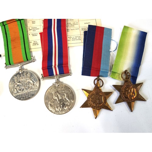 273 - An RAF pin, a Scot's Guards badge, a leather stamp wallet, and medals including the Defence Medal 19... 