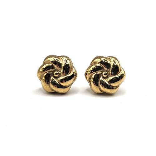 360 - A pair of 9ct yellow gold earrings in flower style with backs 1.9gms.