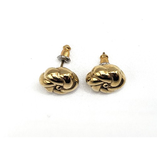 360 - A pair of 9ct yellow gold earrings in flower style with backs 1.9gms.