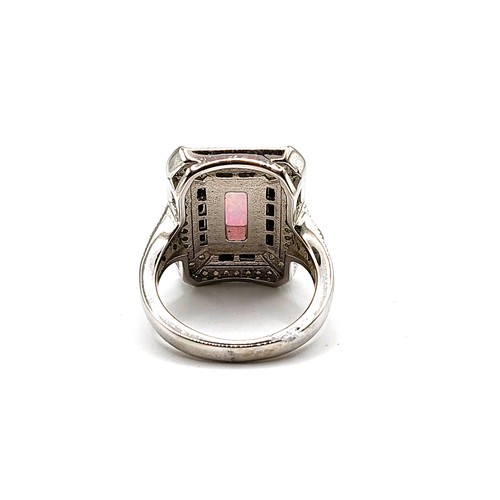 358 - A silver and cubic zirconia dress ring with man made opal panel. Size N 9.3gms.