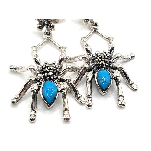 357 - A pair of silver and marcasite set earrings in the form of spider with turquoise coloured abdomen an... 