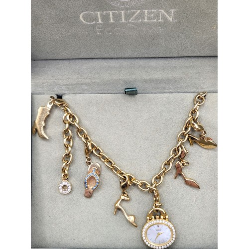 376 - A pair of Citizen Eco Drive ladies charm bracelet watches; one of gold colour, one of silver colour,... 