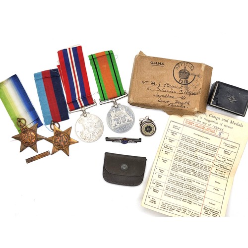 273 - An RAF pin, a Scot's Guards badge, a leather stamp wallet, and medals including the Defence Medal 19... 