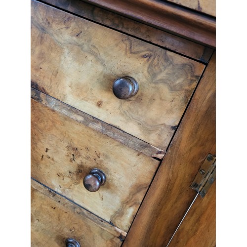 26 - A walnut Wellington chest with seven drawers with wooden knobs, right panel locks to secure drawers.... 