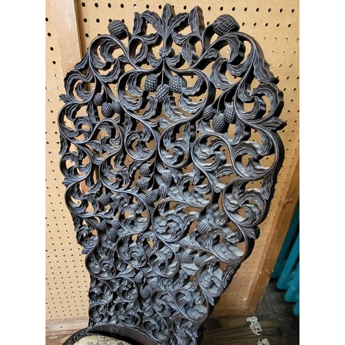 36 - An ornate carved Anglo-Indian occasional chair with scrolled feet. 102cm x 42cm