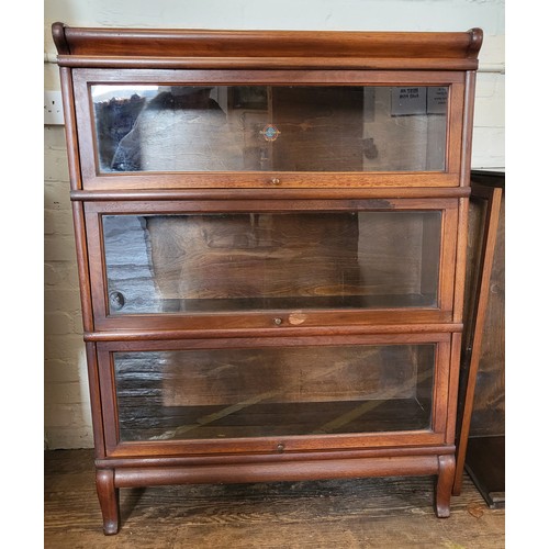 40 - A Globe Wernicke glass fronted four tier bookcase, one tier missing glass and back, slide mechanism ... 