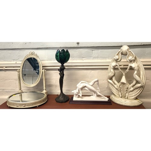 125 - Two mantle sculptures, a bronze/glass table lamp, and a vanity mirror. (4)