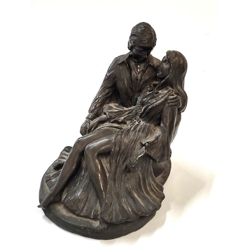 126 - A bronze sculpture of an embracing couple by Jeanne Rynhart E/250.