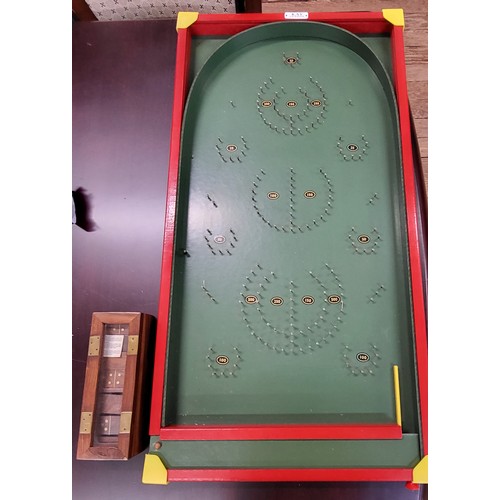 136 - A vintage Bagatelle table and a wooden Domino set, boxed. (2)