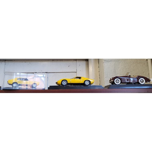 155 - Dinky Toy fawn Standard Vanguard, Merit dark green Jaguar racing number 3, other diecast cars includ... 