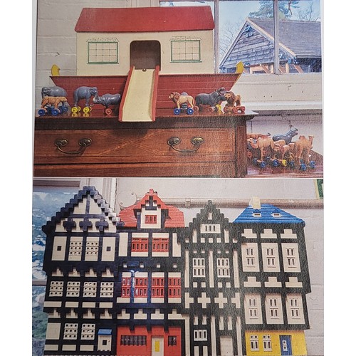 170 - A Lego four-block terraced building with interior electric lighting 52cm wide 35cm high, and a paint... 