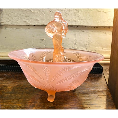 202 - A pink-tinted pressed glass bowl with floral exterior pattern 24cm diameter, and matching ten-hole p... 