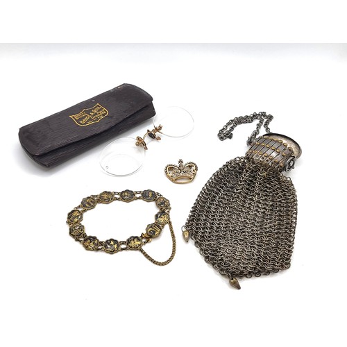 267 - A chain purse with concertina top and hinged lid with foliate design, a pair of pince nez with gold ... 