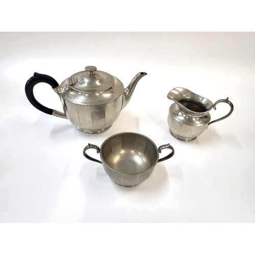 280 - A stainless steel tea pot, milk jug and sugar bowl circa 1930's.