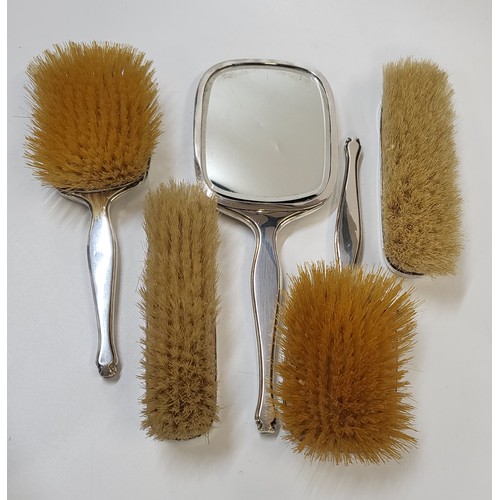 291 - A Mappin & Webb dressing table set comprising of two hair brushes (one brush has a dent) 1939 and 19... 