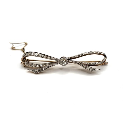 316 - A precious metal (unmarked) brooch in the shape of a bow (white metal consists of 4.9% silver, 14.4%... 