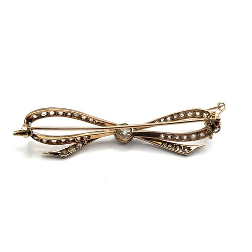 316 - A precious metal (unmarked) brooch in the shape of a bow (white metal consists of 4.9% silver, 14.4%... 