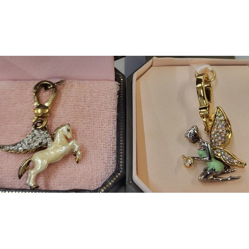 337 - Six Juicy Couture charm/pendants in original branded boxes including Pegasus, dog, snowflake, Tinker... 