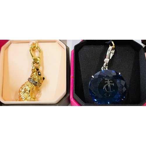 337 - Six Juicy Couture charm/pendants in original branded boxes including Pegasus, dog, snowflake, Tinker... 