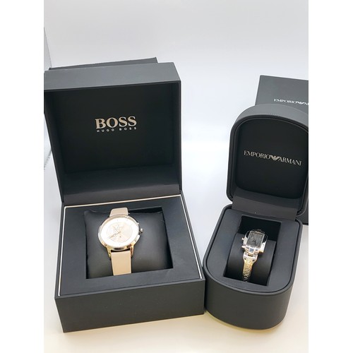 431 - A gentleman's Hugo Boss dress watch in original presentation box and sleeve, and a ladies Emporio Ar... 