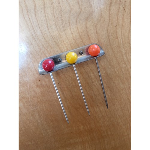 27 - A two-door cocktail mirror-back cabinet (with broken glass shelf),  over two short drawers supported... 