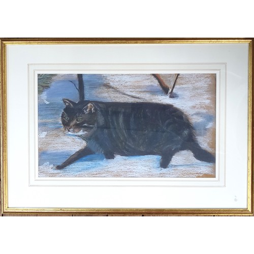 87 - A pastel study of a cat walking in the snow, unsigned. Mounted, glazed and in a gilt frame.