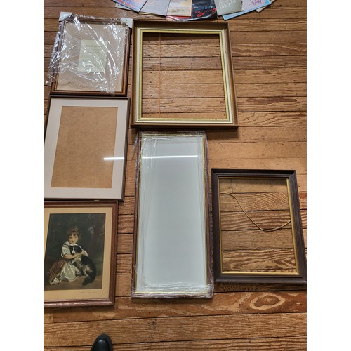 79 - A picture of Miss Bowles and her dog by Renaldo and five picture frames and glass.