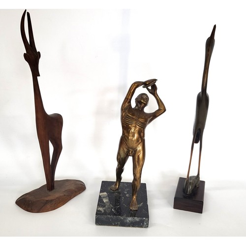 92 - An Art Deco bronze male nude sculpture of a discus thrower, 23cm, and two mid-century wooden ornamen... 