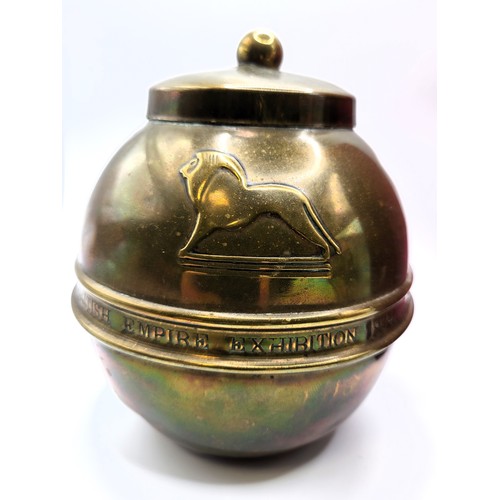 101 - A round brass tea caddy produced as a souvenir of the British Empire Exhibition by Lipton's tea comp... 