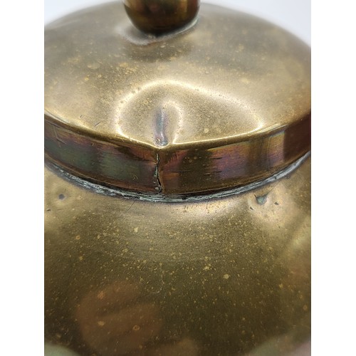 101 - A round brass tea caddy produced as a souvenir of the British Empire Exhibition by Lipton's tea comp... 
