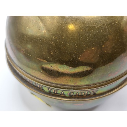 101 - A round brass tea caddy produced as a souvenir of the British Empire Exhibition by Lipton's tea comp... 