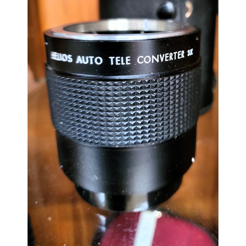 102 - A collection of four various camera lenses, a Prinzgology No 49164 with camera case, Bell & Howell s... 