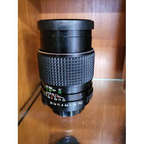 102 - A collection of four various camera lenses, a Prinzgology No 49164 with camera case, Bell & Howell s... 