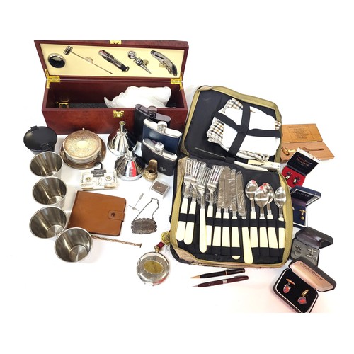 108 - A boxed wine accessories including cork screw and wine stopper, a collapsible stainless steel cup in... 