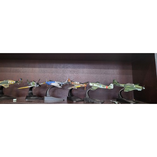 110 - Twelve diecast WWII aircraft including Junkers JU 87.B, Messerschmitt 109.E, and Supermarine Spitfir... 
