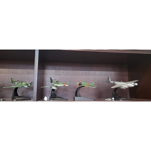 110 - Twelve diecast WWII aircraft including Junkers JU 87.B, Messerschmitt 109.E, and Supermarine Spitfir... 