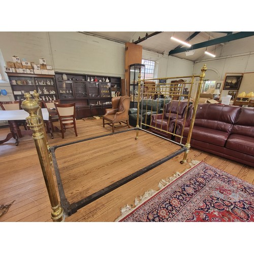 8 - A Victorian brass double bed on castors. Some repair work has been carried out. H:168cm W:140cm L:20... 