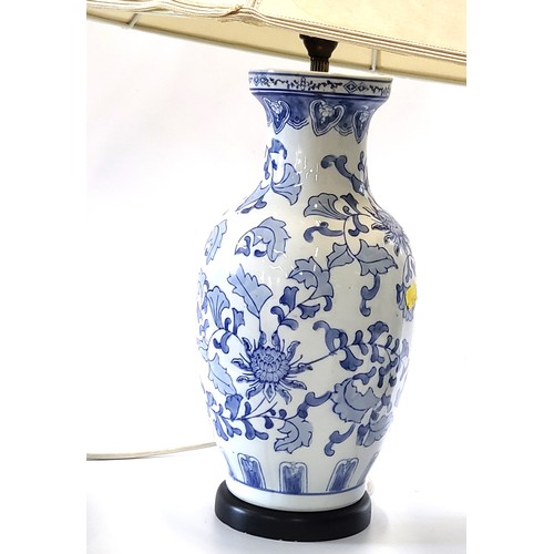 38 - Two blue and white lamps in Oriental style and a turquoise lamp with flooded village scene Heights b... 