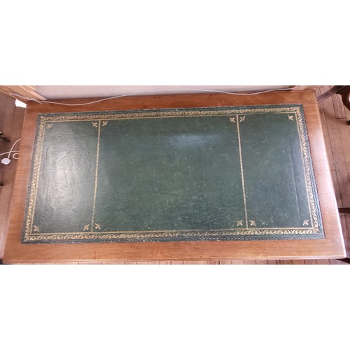 17 - A lady's pedestal desk in three sections with a central drawer, flanked by a set of four drawers 73c... 