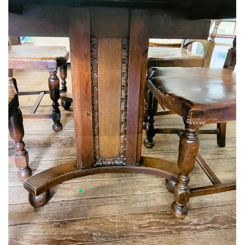 24 - A 1930's oak Ercol table (1273) 78 x 183 x 91cm (when extended) with two leaves (38cm) and six Ercol... 