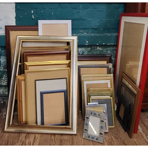 A large quantity of photo and picture frames